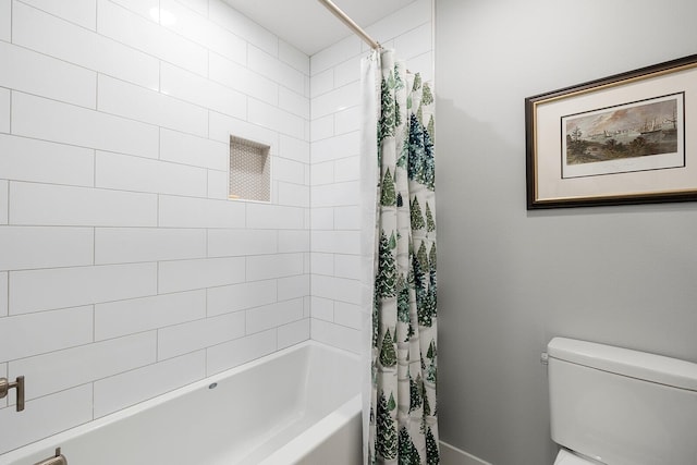 full bathroom with shower / bath combo with shower curtain and toilet