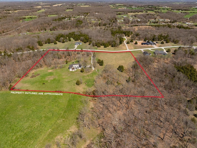 birds eye view of property featuring a rural view