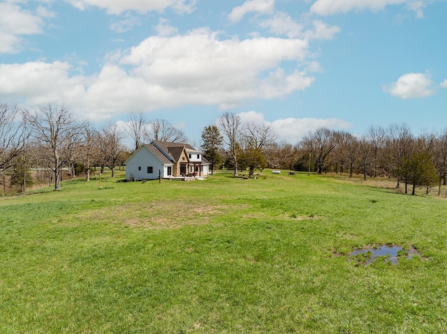 view of yard with a rural view
