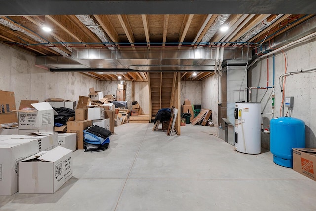 unfinished basement featuring water heater