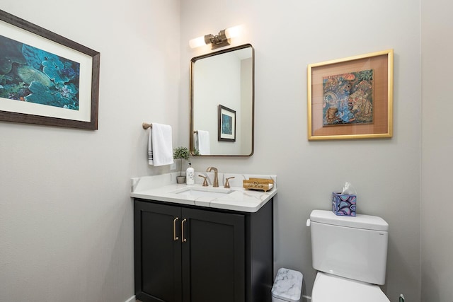 bathroom featuring toilet and vanity