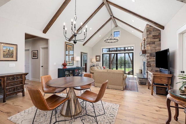dining space featuring beam ceiling, high vaulted ceiling, light wood-type flooring, and a notable chandelier