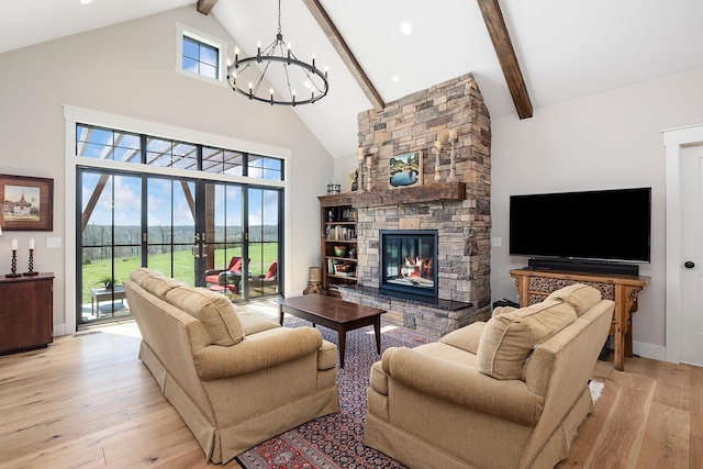 living room with high vaulted ceiling, a fireplace, light wood-style flooring, a notable chandelier, and beam ceiling