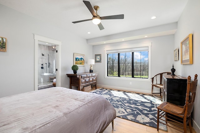 bedroom with baseboards, a ceiling fan, recessed lighting, connected bathroom, and wood finished floors