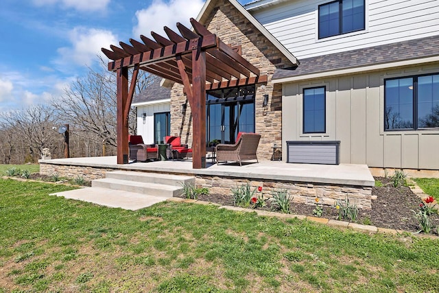 exterior space featuring a patio, a pergola, stone siding, board and batten siding, and a yard
