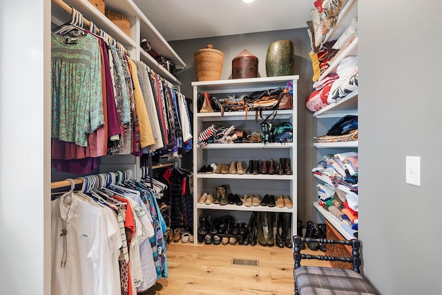 spacious closet with visible vents and wood finished floors