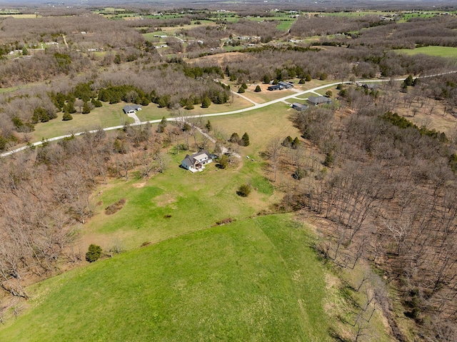 birds eye view of property with a rural view