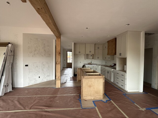 kitchen featuring a center island and white cabinets
