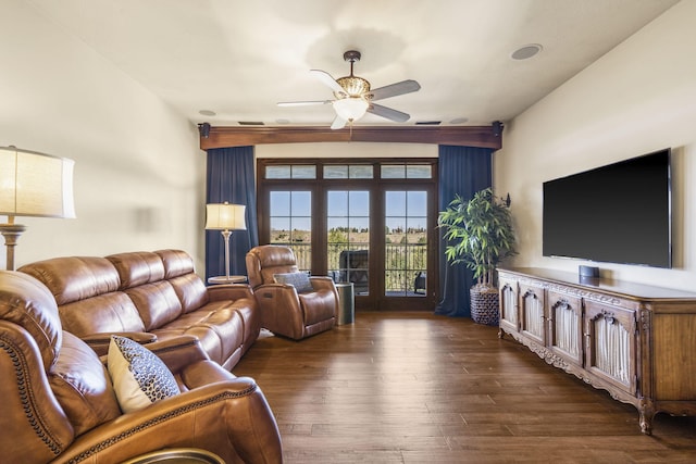 living room with wood finished floors and ceiling fan