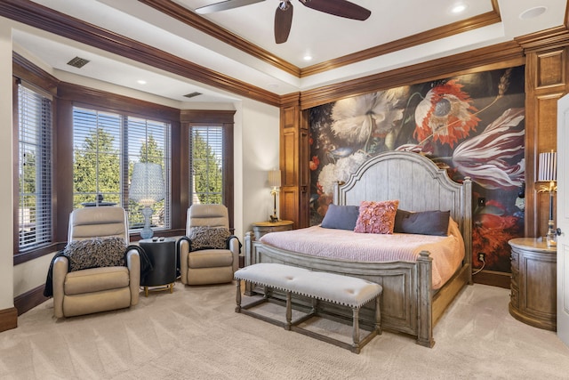 bedroom featuring crown molding, visible vents, a tray ceiling, and light colored carpet