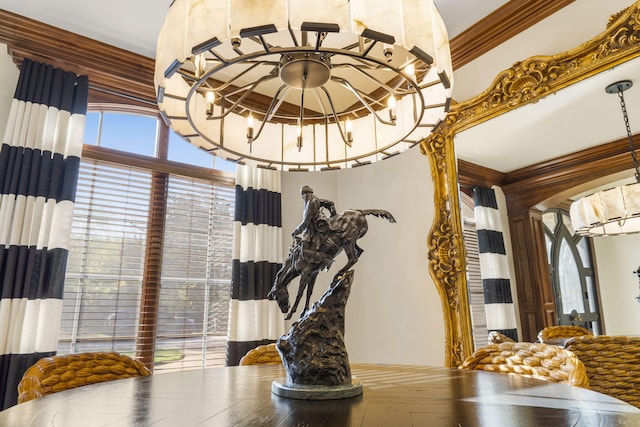 interior details featuring a chandelier and ornamental molding