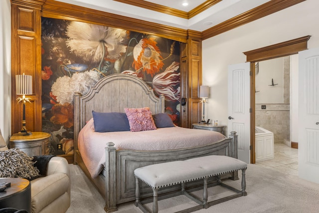 bedroom with ornamental molding, ensuite bathroom, and carpet