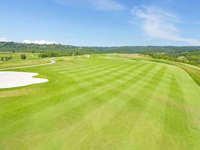 view of home's community featuring golf course view