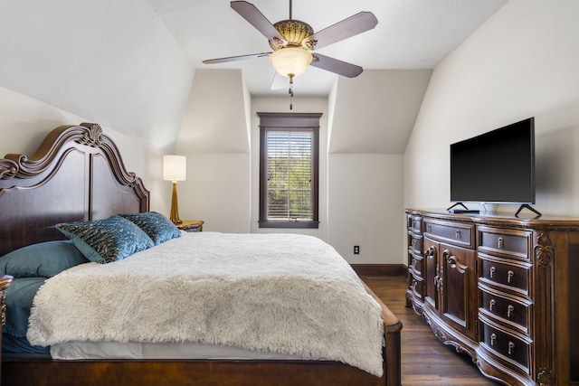 bedroom featuring dark wood-style flooring, baseboards, ceiling fan, and vaulted ceiling