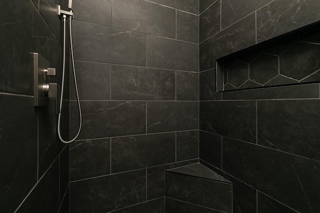 room details with a tile shower