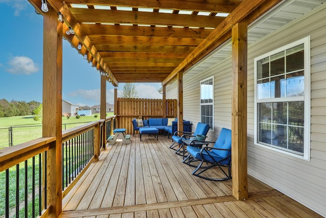 deck with outdoor lounge area and fence