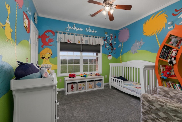 bedroom with crown molding, ceiling fan, carpet, and a crib