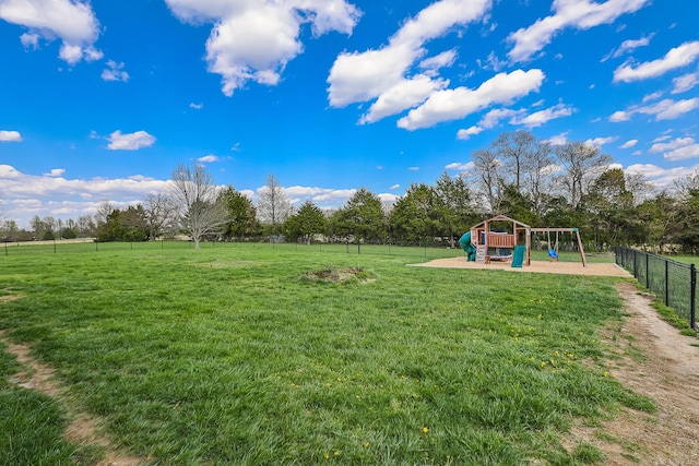 view of yard with fence and playground community