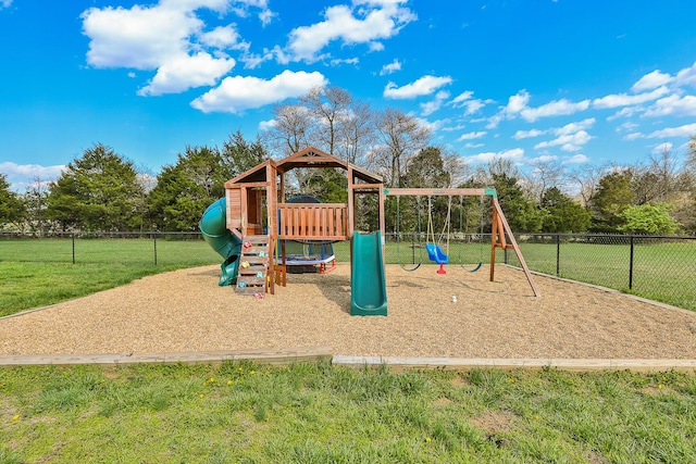 community jungle gym with fence and a lawn