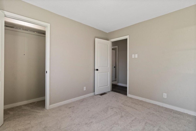 1945 Debra Dr, West Plains, MO 65775 - unfurnished bedroom with a closet, baseboards, and carpet