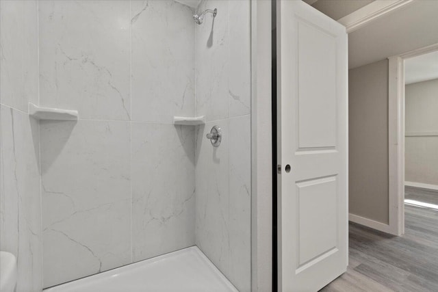 1945 Debra Dr, West Plains, MO 65775 - bathroom featuring a shower, wood finished floors, and baseboards