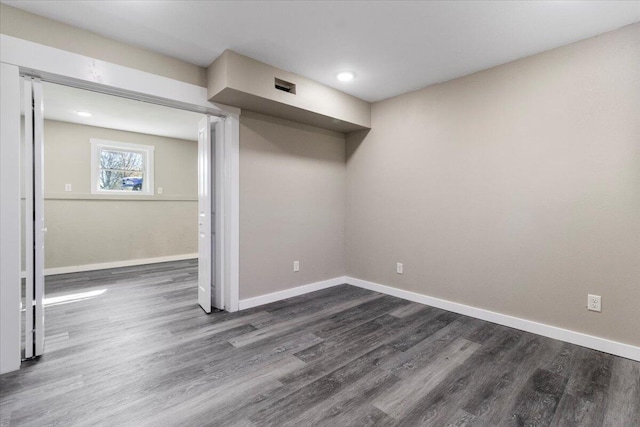 1945 Debra Dr, West Plains, MO 65775 - below grade area featuring baseboards and dark wood-style floors
