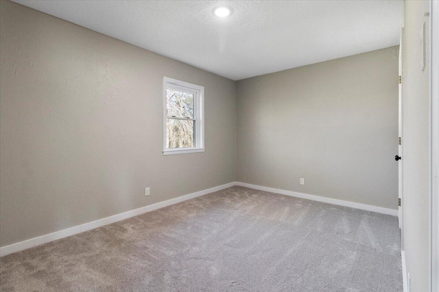 1945 Debra Dr, West Plains, MO 65775 - carpeted spare room with baseboards and a textured ceiling