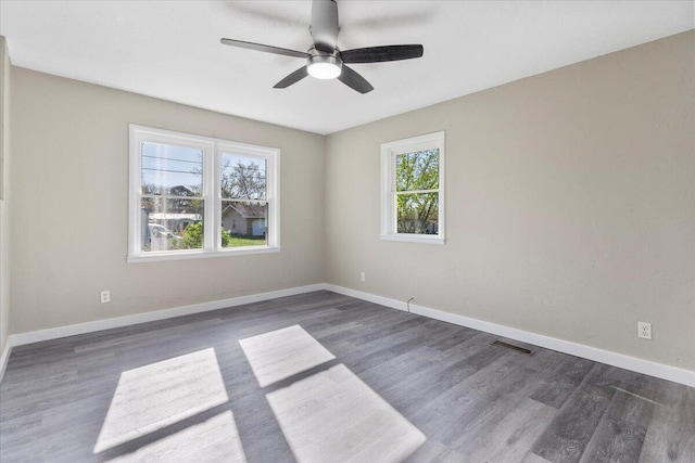 1945 Debra Dr, West Plains, MO 65775 - empty room featuring wood finished floors, ceiling fan, baseboards, and visible vents