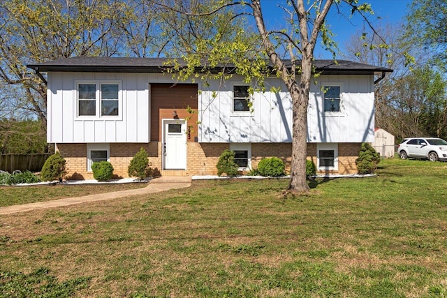 1945 Debra Dr, West Plains, MO 65775 - bi-level home with board and batten siding, fence, and a front lawn