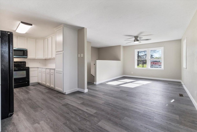1945 Debra Dr, West Plains, MO 65775 - kitchen featuring baseboards, a ceiling fan, dark wood-style floors, black appliances, and decorative backsplash
