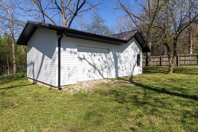 1945 Debra Dr, West Plains, MO 65775 - view of side of home with an outbuilding, fence, a garage, and a lawn