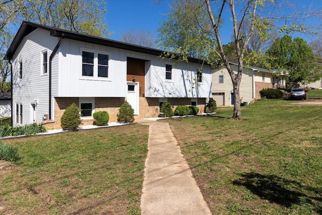 1945 Debra Dr, West Plains, MO 65775 - raised ranch with brick siding, board and batten siding, and a front lawn