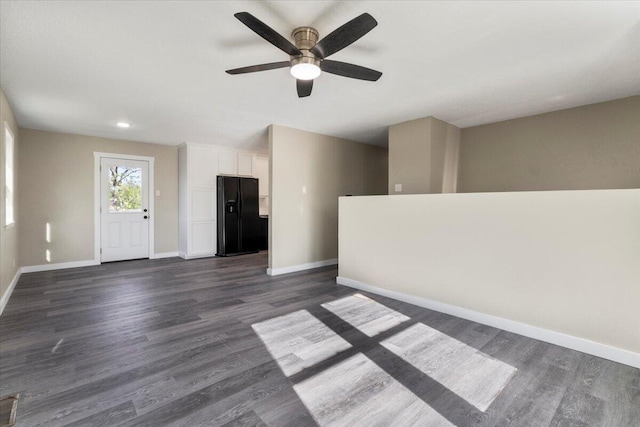 1945 Debra Dr, West Plains, MO 65775 - unfurnished room with dark wood-style flooring, baseboards, and a ceiling fan
