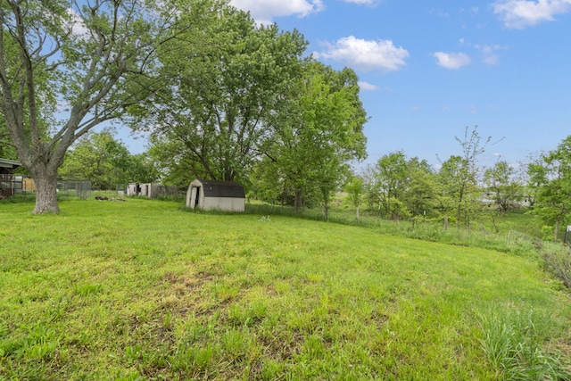 206 E 7th St, Miller, MO 65707 - view of yard with a storage shed, fence, and an outdoor structure