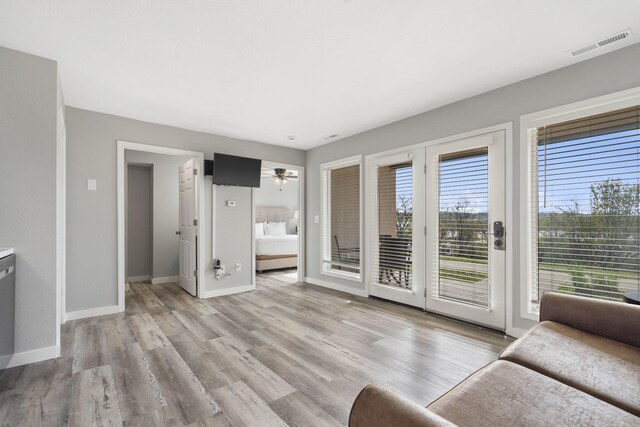 611 Rock Ln Unit 402, Branson, MO 65616 - living area with baseboards, light wood-style floors, and visible vents