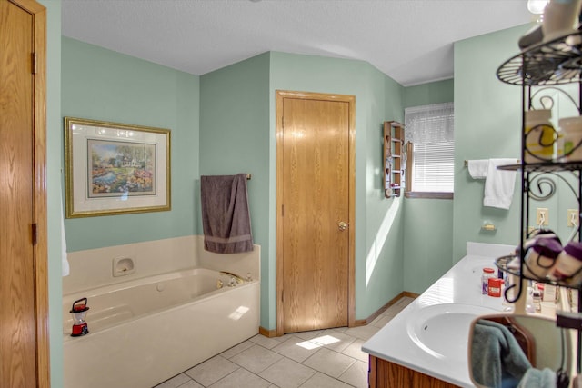 full bath with tile patterned flooring, double vanity, a textured ceiling, a bath, and a sink