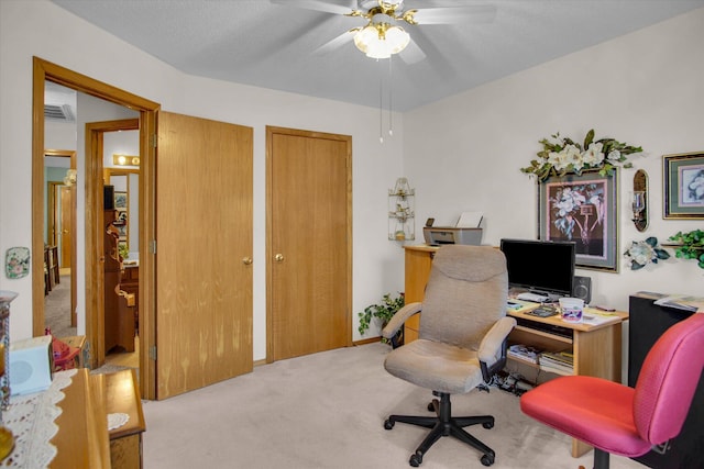 home office featuring carpet floors and ceiling fan