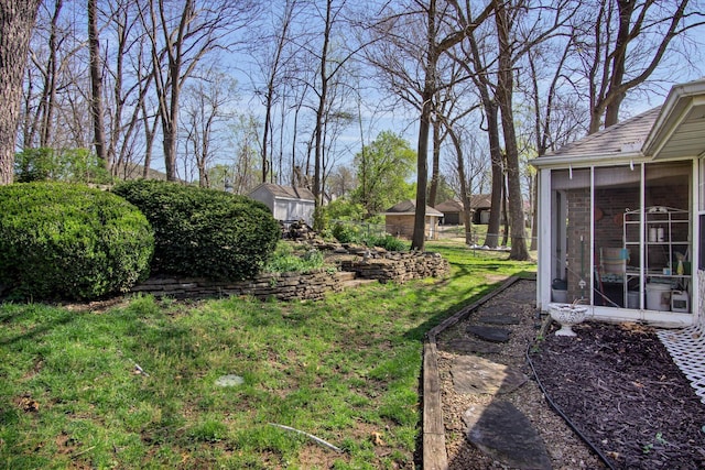 view of yard with fence and a sunroom