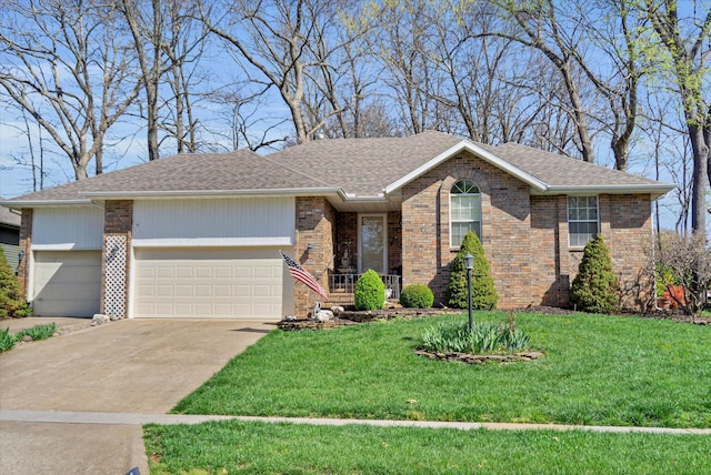 ranch-style house featuring roof with shingles, a garage, brick siding, a front lawn, and concrete driveway