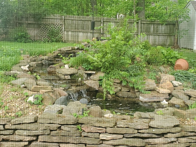 3899 W Woodland St, Springfield, MO 65807 - view of yard with fence