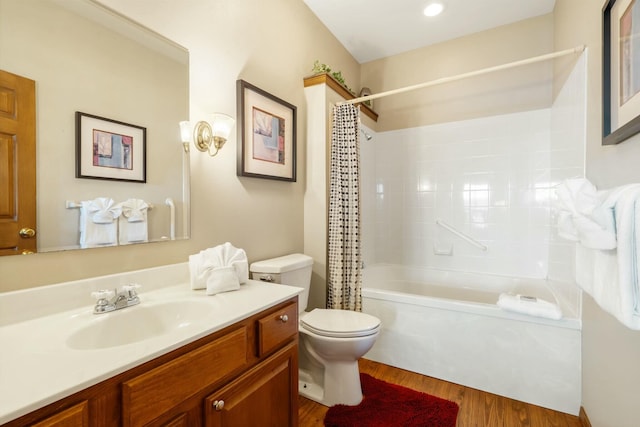 full bathroom featuring shower / tub combo with curtain, vanity, toilet, and wood finished floors