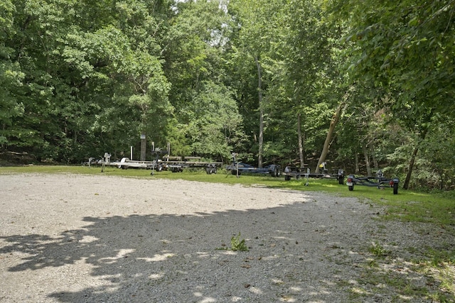 view of property's community featuring a wooded view
