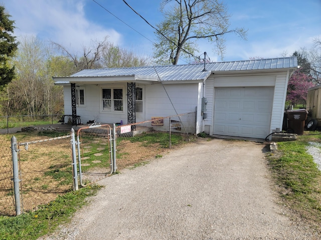 350 Kentling Ave, Highlandville, MO 65669 - ranch-style home with a fenced front yard, metal roof, and aphalt driveway