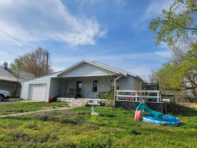 350 Kentling Ave, Highlandville, MO 65669 - view of front of house with aphalt driveway, a front yard, and covered porch