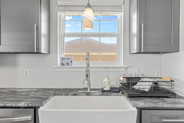 715 Woodlawn St, Marshfield, MO 65706 - kitchen featuring gray cabinetry, dishwasher, a sink, and dark countertops