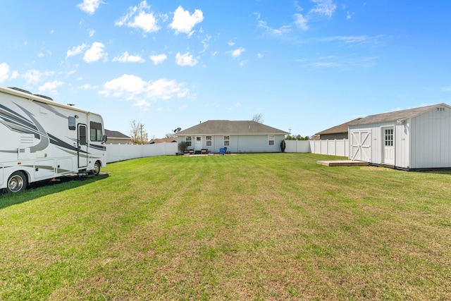 715 Woodlawn St, Marshfield, MO 65706 - view of yard with a fenced backyard, an outbuilding, and a storage unit