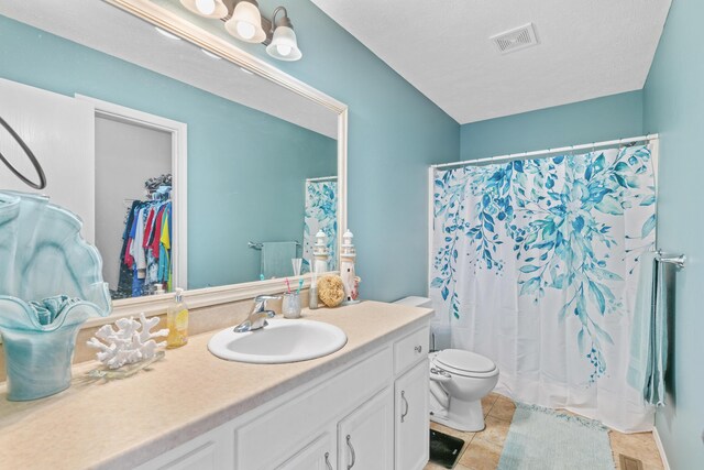 715 Woodlawn St, Marshfield, MO 65706 - full bath with vanity, curtained shower, tile patterned floors, toilet, and visible vents