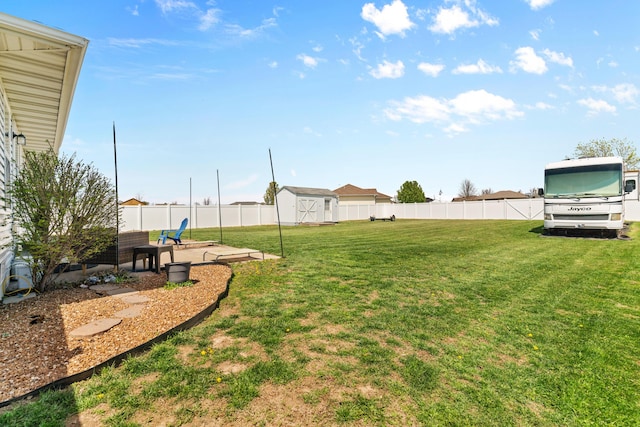 715 Woodlawn St, Marshfield, MO 65706 - view of yard featuring a shed, a patio area, a fenced backyard, and an outdoor structure
