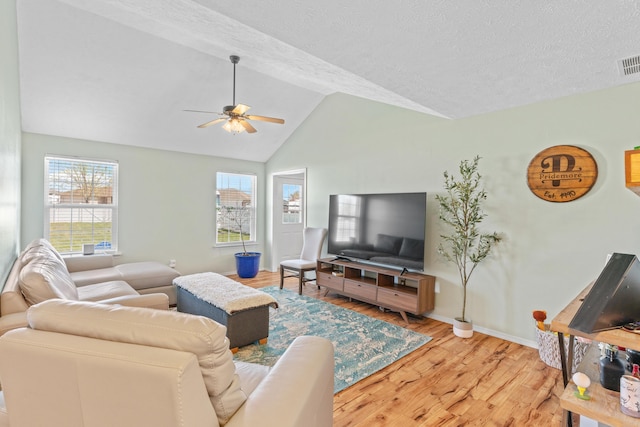 715 Woodlawn St, Marshfield, MO 65706 - living area with ceiling fan, visible vents, wood finished floors, lofted ceiling, and baseboards