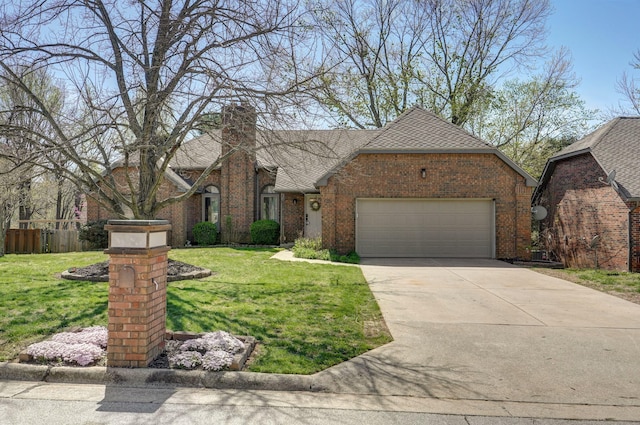 view of front facade featuring a garage, a chimney, concrete driveway, brick siding, and a front lawn